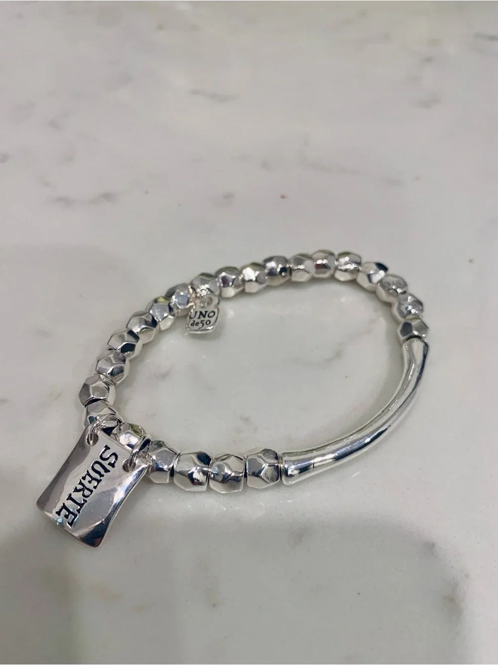 UNO de 50 Silver Faceted Bead Bracelet with SUERTE Charm